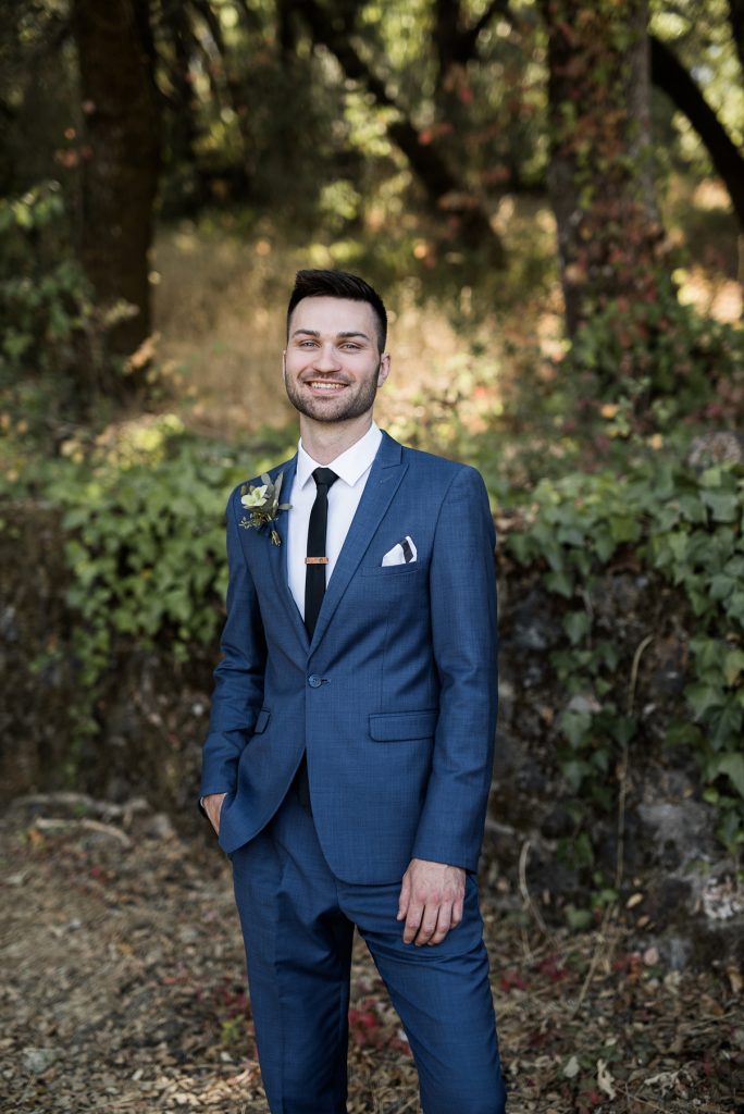groom wearing a classic blue suit
