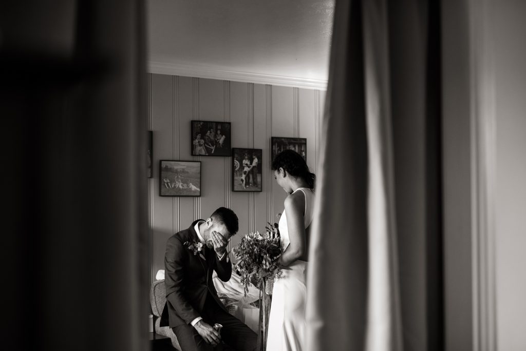 private moment between a bride and groom after their ceremony