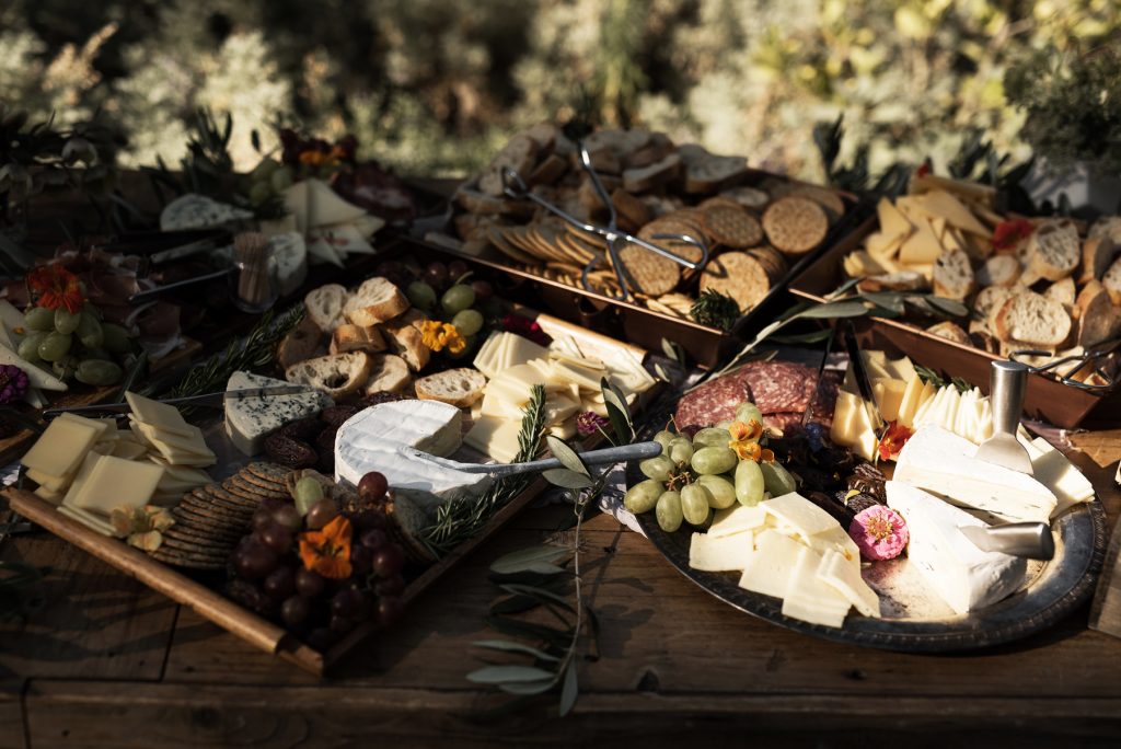 elaborate charcuterie board with edible flowers